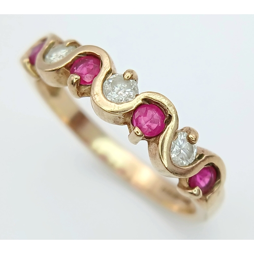512 - A 9K GOLD RING WITH WHITE AND PINK STONES .    2.4gms    size P