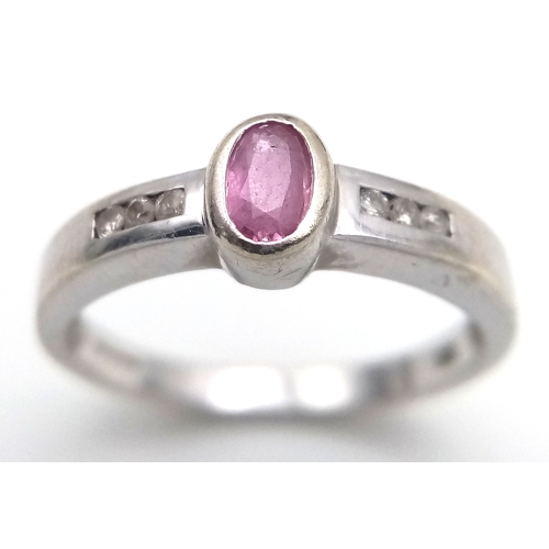 534 - A 9K White Gold, Pink Sapphire and Diamond Ring. Size L 1/2. 2.4g. MT26.