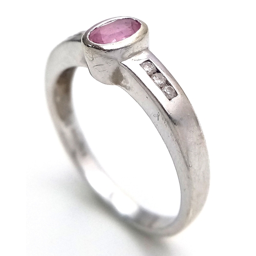 534 - A 9K White Gold, Pink Sapphire and Diamond Ring. Size L 1/2. 2.4g. MT26.