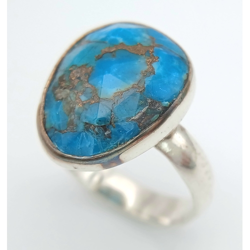 1028 - A Vintage Sterling Silver and Turquoise Set Ring Size P. Set with baroque shape 1.5cm Long Turquoise... 
