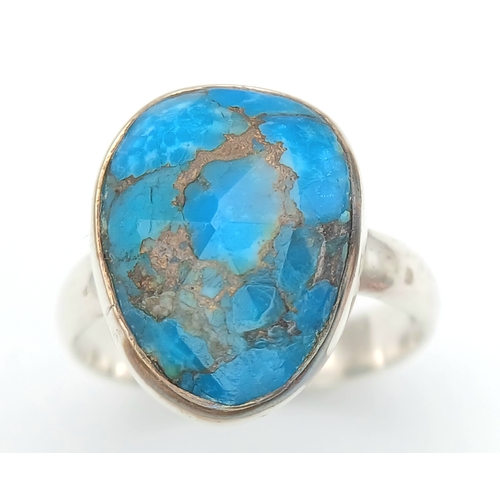 1028 - A Vintage Sterling Silver and Turquoise Set Ring Size P. Set with baroque shape 1.5cm Long Turquoise... 