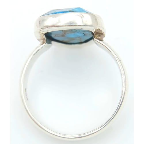 1028 - A Vintage Sterling Silver and Turquoise Set Ring Size P. Set with baroque shape 1.5cm Long Turquoise... 
