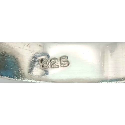 1028 - A Vintage Sterling Silver and Turquoise Set Ring Size P. Set with baroque shape 1.5cm Long Turquoise... 