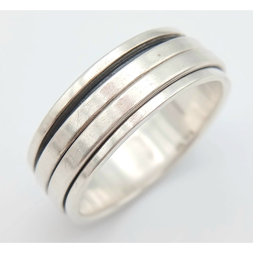 1063 - A Vintage Hallmarked Sterling Silver Spinner Band Ring Size X. Measures 9mm Wide and weighs 8.03 Gra... 