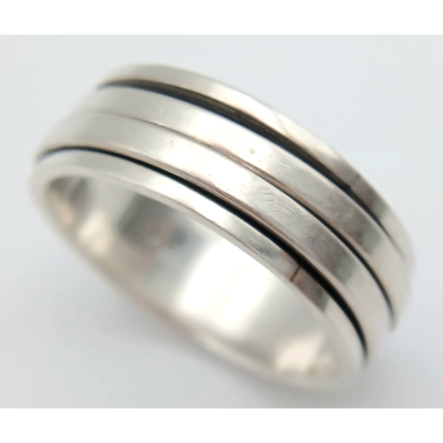 1063 - A Vintage Hallmarked Sterling Silver Spinner Band Ring Size X. Measures 9mm Wide and weighs 8.03 Gra... 