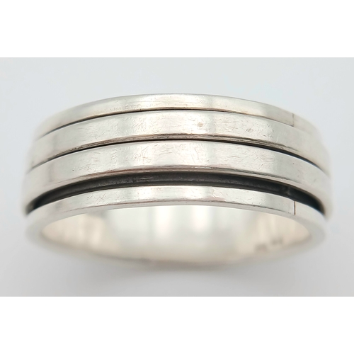 1063 - A Vintage Hallmarked Sterling Silver Spinner Band Ring Size X. Measures 9mm Wide and weighs 8.03 Gra... 