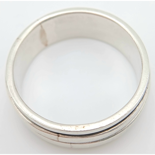 1063 - A Vintage Hallmarked Sterling Silver Spinner Band Ring Size X. Measures 9mm Wide and weighs 8.03 Gra... 