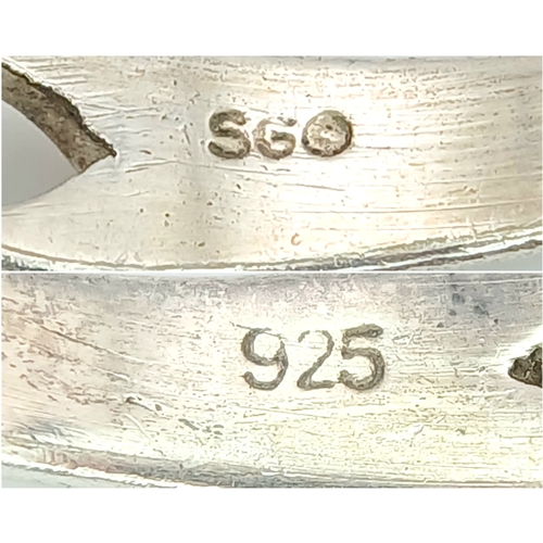 1077 - A Vintage Celtic Design Sterling Silver and Blue Topaz Ring Size S. Set with a 6 x 4mm Oval Cut Blue... 