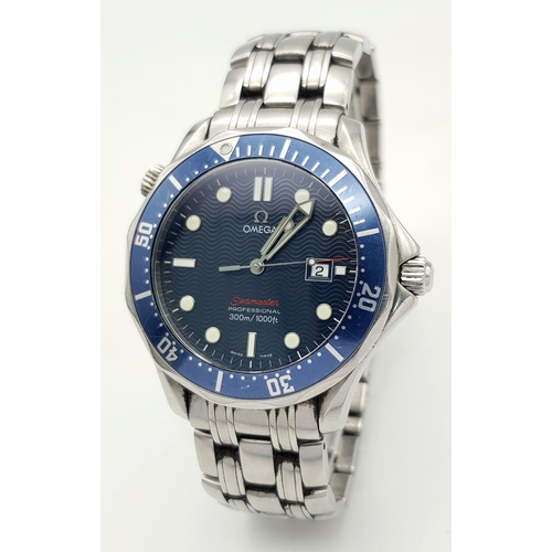 An Omega Seamaster Professional Quartz Gents Watch. Model 22218000. Stainless steel bracelet and case - 42mm. Blue wave dial with date window. Anti-clockwise rotating bezel. Water resistant to 300M. In working order. Comes with box and an array of papers. Ref: 27073.