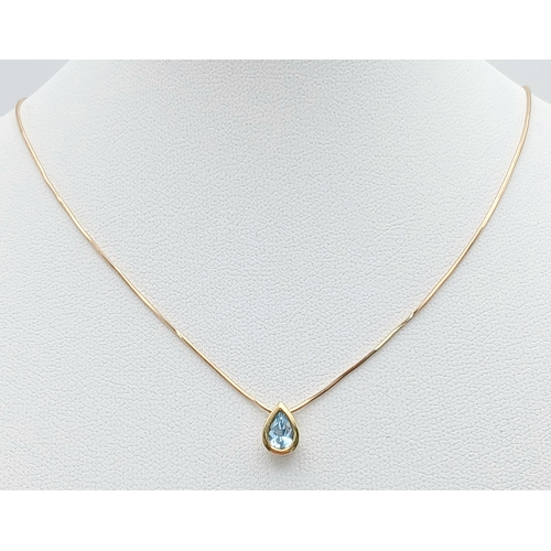 502 - A Pretty 9 Carat Gold Blue Topaz Set Pendant Necklace-41cm Length Chain. The Pendant is set with a v... 
