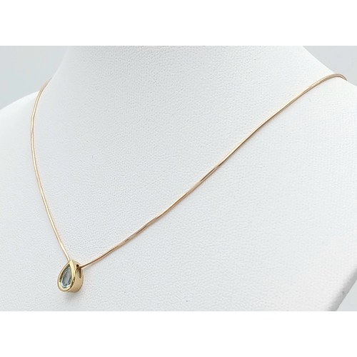 502 - A Pretty 9 Carat Gold Blue Topaz Set Pendant Necklace-41cm Length Chain. The Pendant is set with a v... 