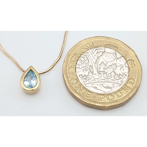 502 - A Pretty 9 Carat Gold Blue Topaz Set Pendant Necklace-41cm Length Chain. The Pendant is set with a v... 