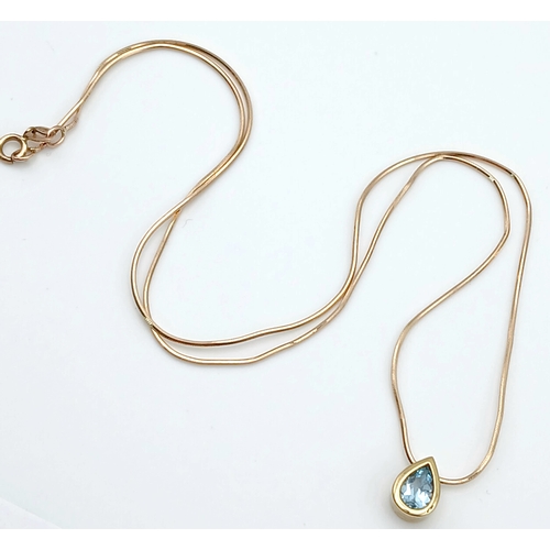 502 - A Pretty 9 Carat Gold Blue Topaz Set Pendant Necklace-41cm Length Chain. The Pendant is set with a v... 