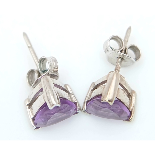 509 - A Pretty Pair of 9 Carat White Gold Trillion Cut, Top Colour, Amethyst Stud Earrings. The Earrings m... 
