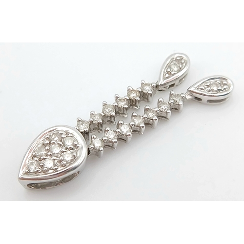 514 - AN 18K WHITE GOLD, DIAMOND SET, DROP PENDANT. 0.15TCW, 1.3G. SC 5038