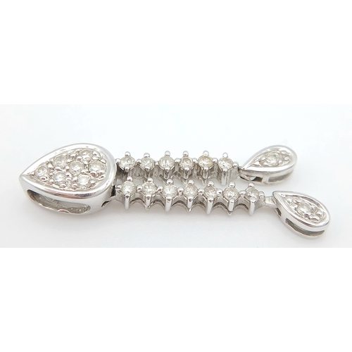 514 - AN 18K WHITE GOLD, DIAMOND SET, DROP PENDANT. 0.15TCW, 1.3G. SC 5038