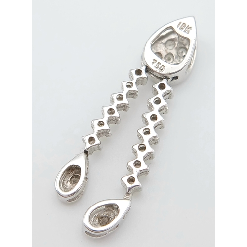 514 - AN 18K WHITE GOLD, DIAMOND SET, DROP PENDANT. 0.15TCW, 1.3G. SC 5038