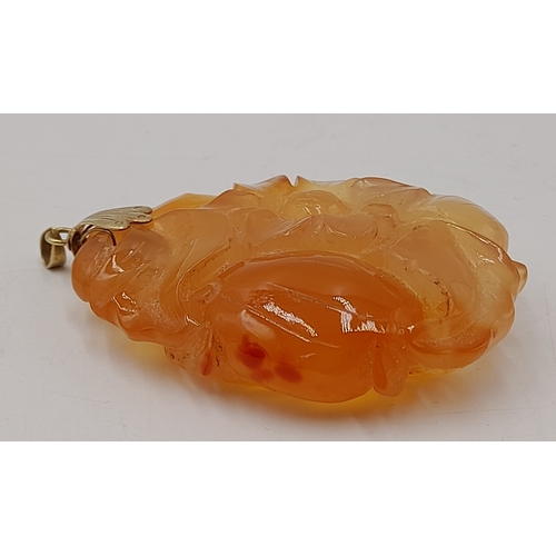 537 - A Vintage 14 Carat Yellow Gold Chinese Carved Orange Carnelian Pendant. 6cm Length. Gross weight 34.... 