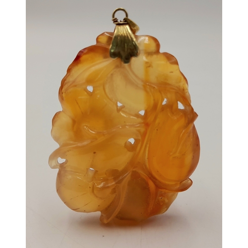 537 - A Vintage 14 Carat Yellow Gold Chinese Carved Orange Carnelian Pendant. 6cm Length. Gross weight 34.... 