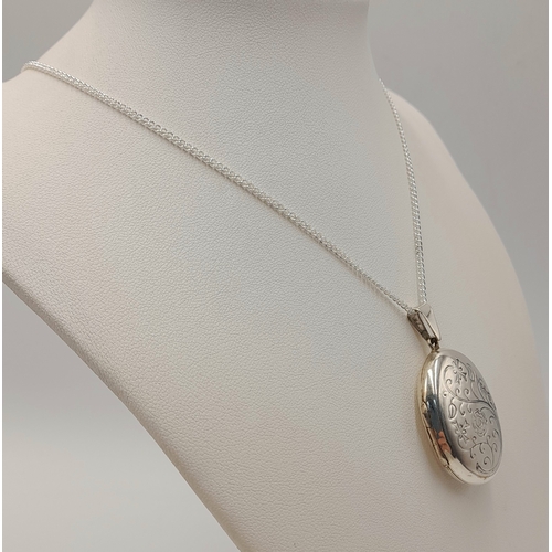 557 - A Vintage Sterling Silver Scroll and Love Poem Detailed Locket Pendant on a later 46cm Sterling Silv... 