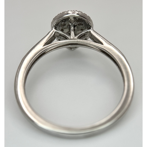 559 - A 9K WHITE GOLD, DIAMOND SET, PEAR SHAPED HALO CLUSTER RING. 0.28TCW, 2.5G, SIZE O. 10127