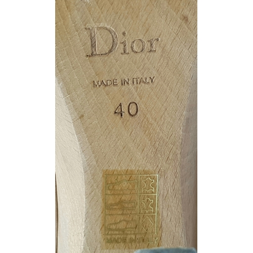 1047 - A Pair of Christian Dior Brown T-Strap Platform Heels. Leather with gold-toned hardware and wood hee... 