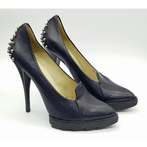 1054 - A Pair of Alexander McQueen Black Stud Heels. Leather exterior with stud embellishments. European si... 
