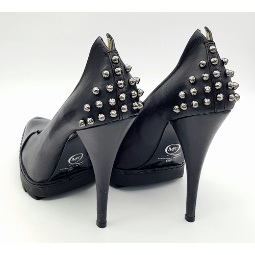 1054 - A Pair of Alexander McQueen Black Stud Heels. Leather exterior with stud embellishments. European si... 