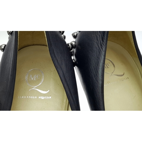 1054 - A Pair of Alexander McQueen Black Stud Heels. Leather exterior with stud embellishments. European si... 