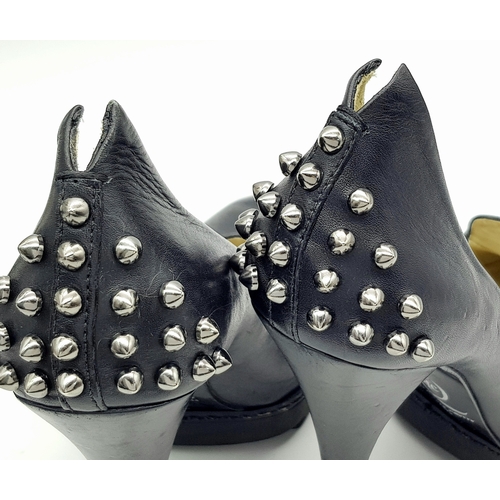 1054 - A Pair of Alexander McQueen Black Stud Heels. Leather exterior with stud embellishments. European si... 