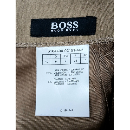 1075 - A Hugo Boss Camel Pencil Skirt. UK size 10. Zip to the back. Approximately 61cm length. In good cond... 