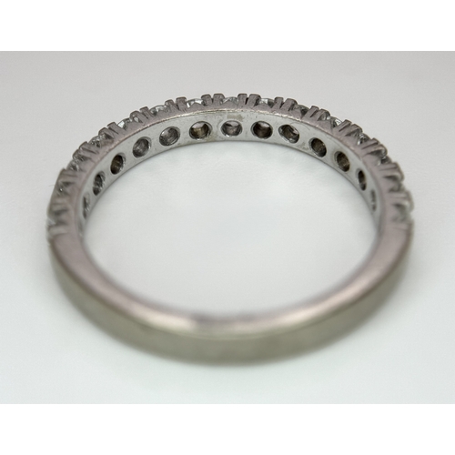 1018 - An 18K White Gold Lab Grown Diamond Half Eternity Ring. Size R. 4.2g. IIB/28055.
