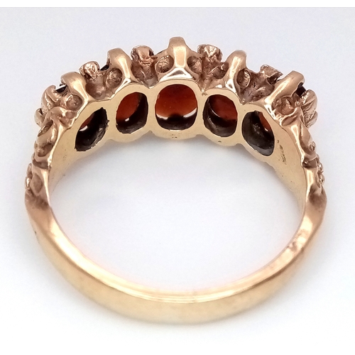 1025 - A 9K Yellow Gold Garnet Five Stone Ring. Size M. 4.2g. N26/11606.