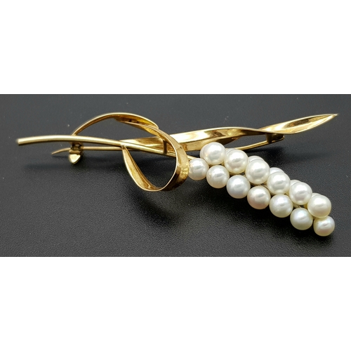 1096 - A 14K Yellow Gold and Pearl Brooch. Abstract form with almost a vine vibe that leads to 19 bright wh... 