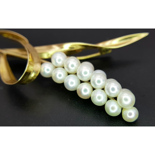 1096 - A 14K Yellow Gold and Pearl Brooch. Abstract form with almost a vine vibe that leads to 19 bright wh... 