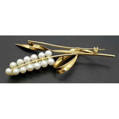 1096 - A 14K Yellow Gold and Pearl Brooch. Abstract form with almost a vine vibe that leads to 19 bright wh... 