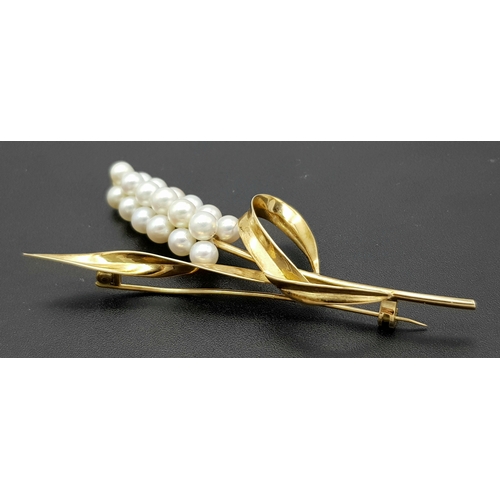 1096 - A 14K Yellow Gold and Pearl Brooch. Abstract form with almost a vine vibe that leads to 19 bright wh... 