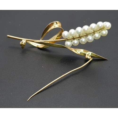 1096 - A 14K Yellow Gold and Pearl Brooch. Abstract form with almost a vine vibe that leads to 19 bright wh... 