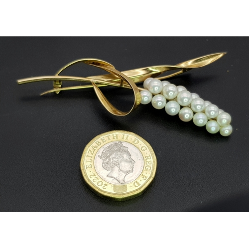 1096 - A 14K Yellow Gold and Pearl Brooch. Abstract form with almost a vine vibe that leads to 19 bright wh... 