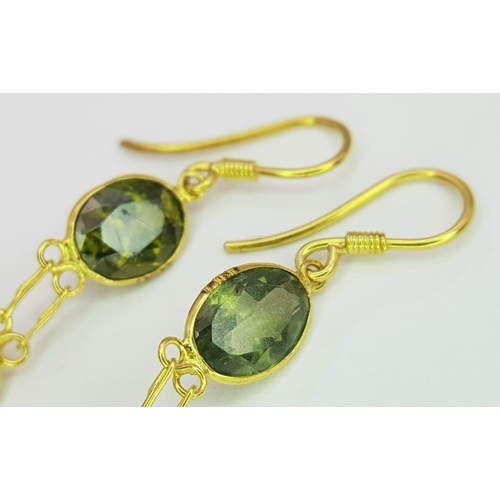 1103 - A Pair of 10K Yellow Gold Stone-Set Drop Earrings. 3.5cm drop. 1.25g. Comes with a coa. NL007.
