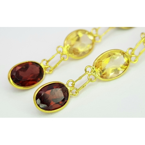 1103 - A Pair of 10K Yellow Gold Stone-Set Drop Earrings. 3.5cm drop. 1.25g. Comes with a coa. NL007.
