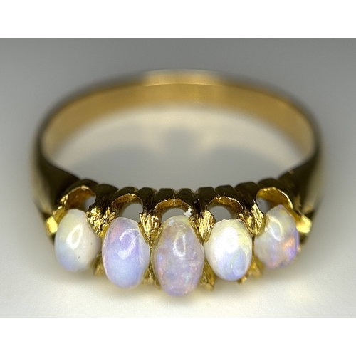 1124 - An 18K Yellow Gold Five Stone Opal Ring. Wonderful colour-play. Size K. 3.1g. NL19/c2205.