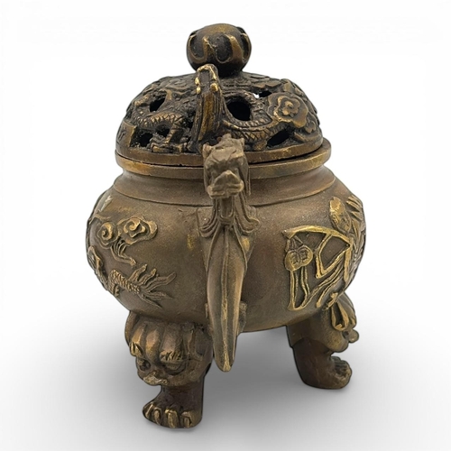 1170 - An Antique Chinese Bronze Tripod Incense Burner with Dragon Relief and Pierced Lid, Da Qing Qianlong... 