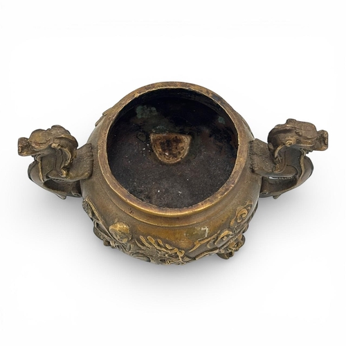 1170 - An Antique Chinese Bronze Tripod Incense Burner with Dragon Relief and Pierced Lid, Da Qing Qianlong... 