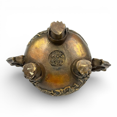 1170 - An Antique Chinese Bronze Tripod Incense Burner with Dragon Relief and Pierced Lid, Da Qing Qianlong... 