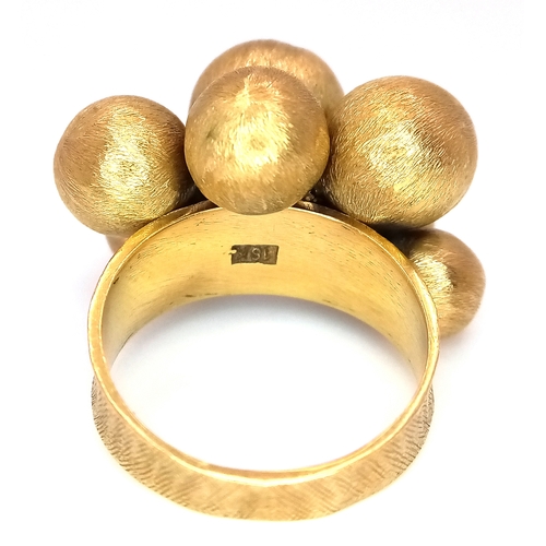1010 - An 18K Yellow Gold Ornate Ball Ring. Different sized brushed gold balls. Size L. 8.45g.