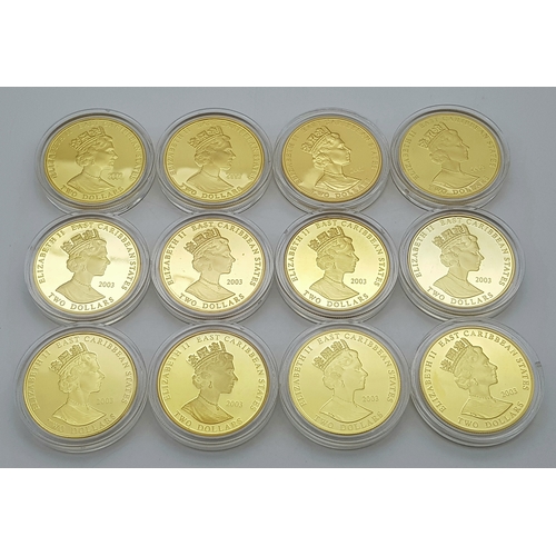 1017 - A Westminster 24K Gold Plated Proof Coin Set. 12, 2003 Queen Elizabet II Commemorative East Caribbea... 