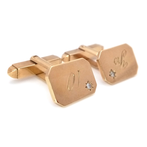 1024 - AN UNUSUAL PAIR OF 9K GOLD CUFFLINKS WITH A SMALL DIAMOND IN EACH - CELEBRATING 10 YEARS. 10.4g.