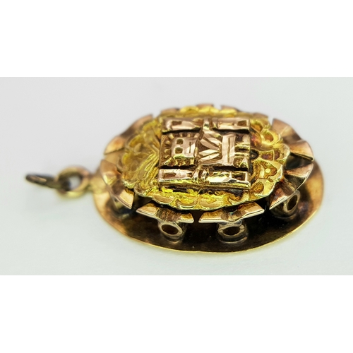 1053 - An 18K Gold Atocha Pendant. 2cm. 3g.