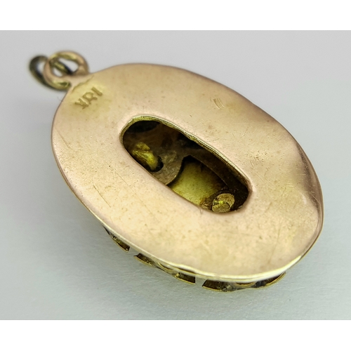 1053 - An 18K Gold Atocha Pendant. 2cm. 3g.